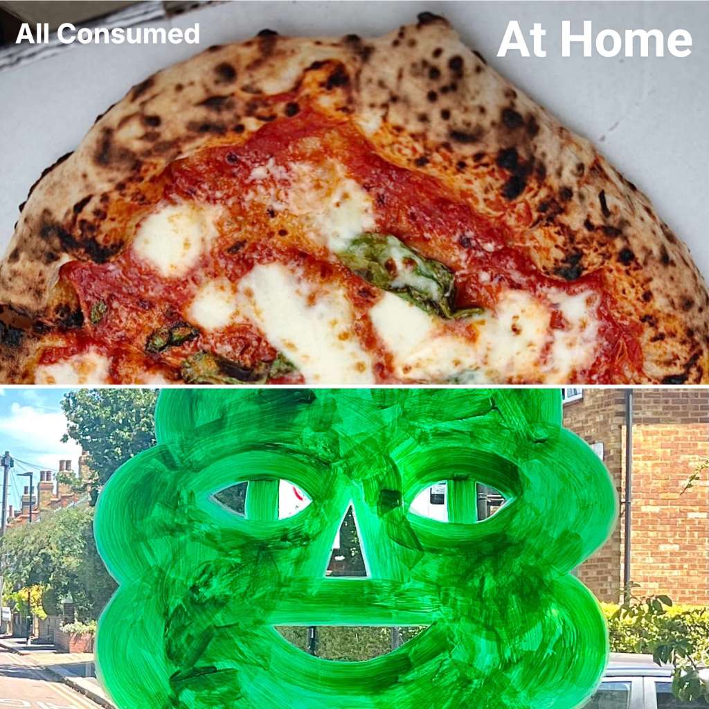 A close-up of a pizza with melted cheese and tomato sauce on a charred crust, placed in a box.